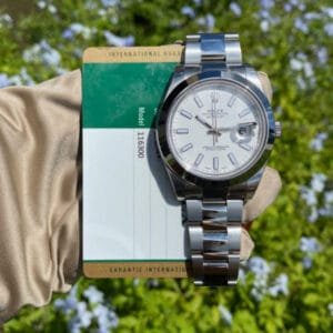 Rolex Model 116300: 41mm stainless steel case, white dial, smooth bezel, stainless steel bracelet, and automatic movement.